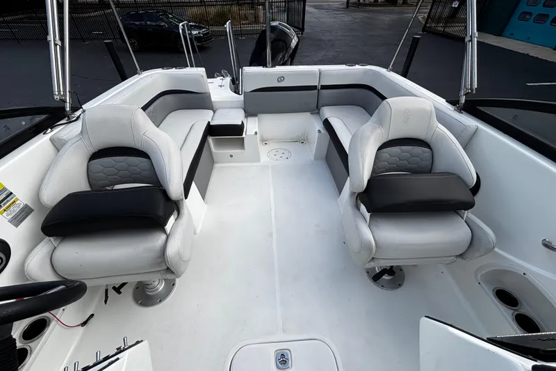 Slide: The Image of 2022 Hurricane SunDeck 217 OB boat interior with plush seating and modern design. - 8
