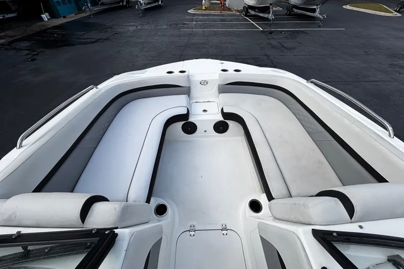 Slide: The Image of 2022 Hurricane SunDeck 217 OB boat interior with spacious seating and sleek design. - 9