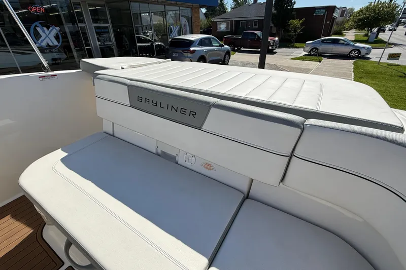 Slide: The Image of 2016 Bayliner VR5 Bowrider I/O boat interior with cushioned seating and sleek design. - 16