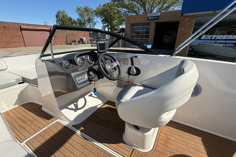 Slide: The Image of 2016 Bayliner VR5 Bowrider I/O cockpit with modern dashboard and comfortable seating. - 17