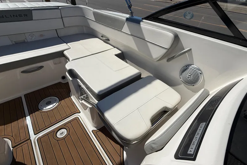 Slide: The Image of 2016 Bayliner VR5 Bowrider I/O interior with white seating and wood-patterned flooring. - 20