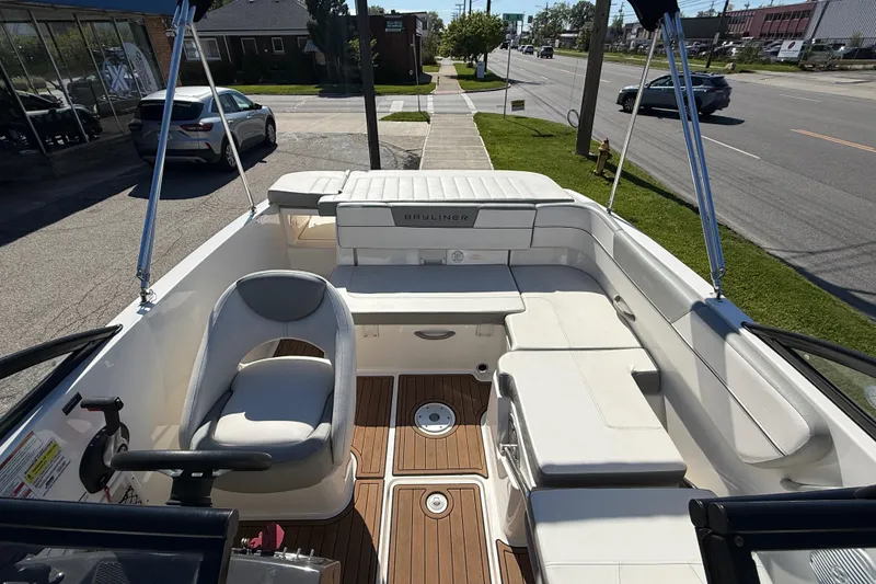 Slide: The Image of 2016 Bayliner VR5 Bowrider I/O interior with seating and steering wheel, parked on street. - 21