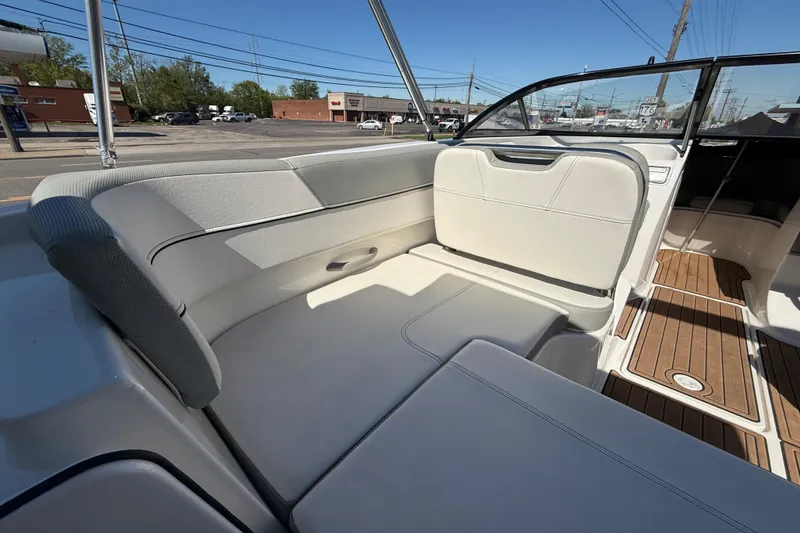 Slide: The Image of 2016 Bayliner VR5 Bowrider I/O interior with white seating and wood flooring. - 24