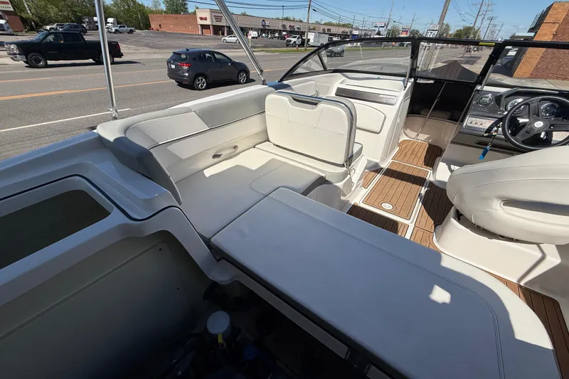 Slide: The Image of 2016 Bayliner VR5 Bowrider I/O interior with seating and steering wheel, parked on street. - 26
