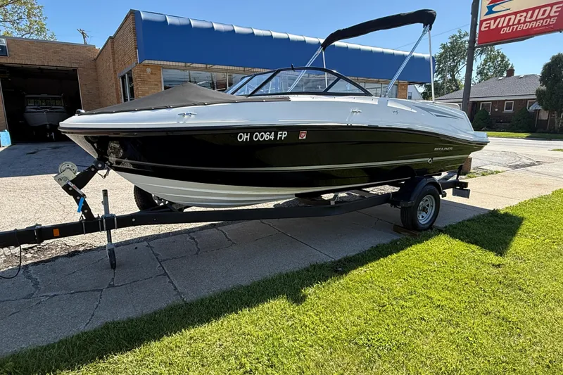 Slide: The Image of 2016 Bayliner VR5 Bowrider I/O on trailer, parked outside a building. - 3