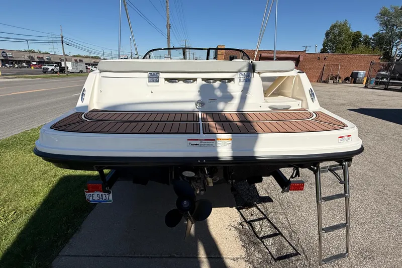 Slide: The Image of 2016 Bayliner VR5 Bowrider I/O with swim platform and ladder, parked outdoors. - 5