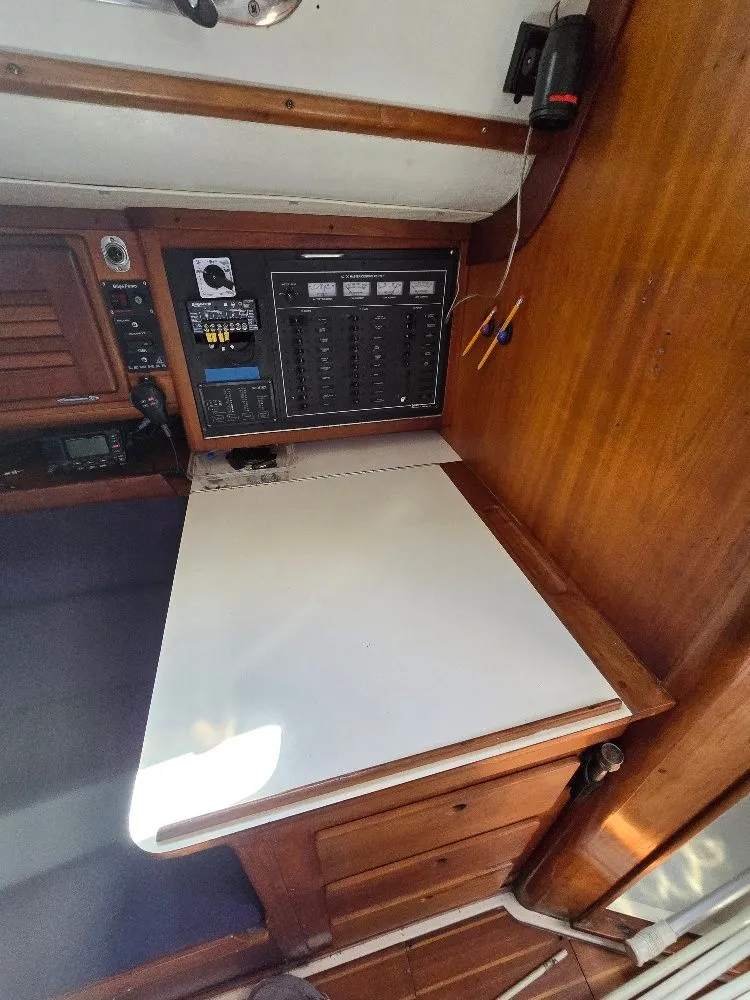 Slide: The Image of Interior of a 1995 Freedom sloop with navigation area. - 10