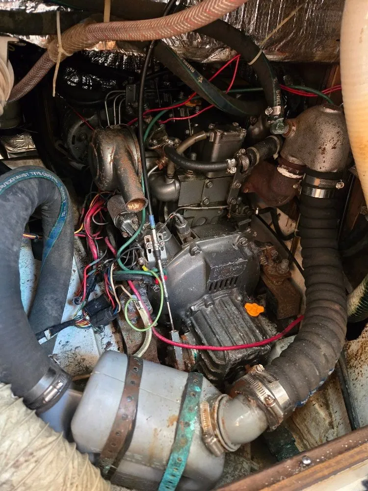 Slide: The Image of Engine compartment of a 1995 Freedom sloop with wires and hoses. - 18