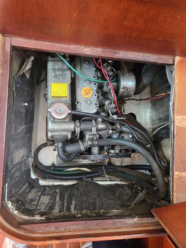 Slide: The Image of Engine compartment of a 1995 Freedom sloop with visible engine. - 19
