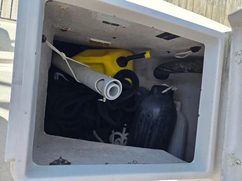 Slide: The Image of Storage compartment of a 1995 Freedom sloop with ropes and accessories. - 25