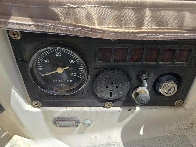 Slide: The Image of Dashboard of a 1995 Freedom sloop with tachometer. - 28