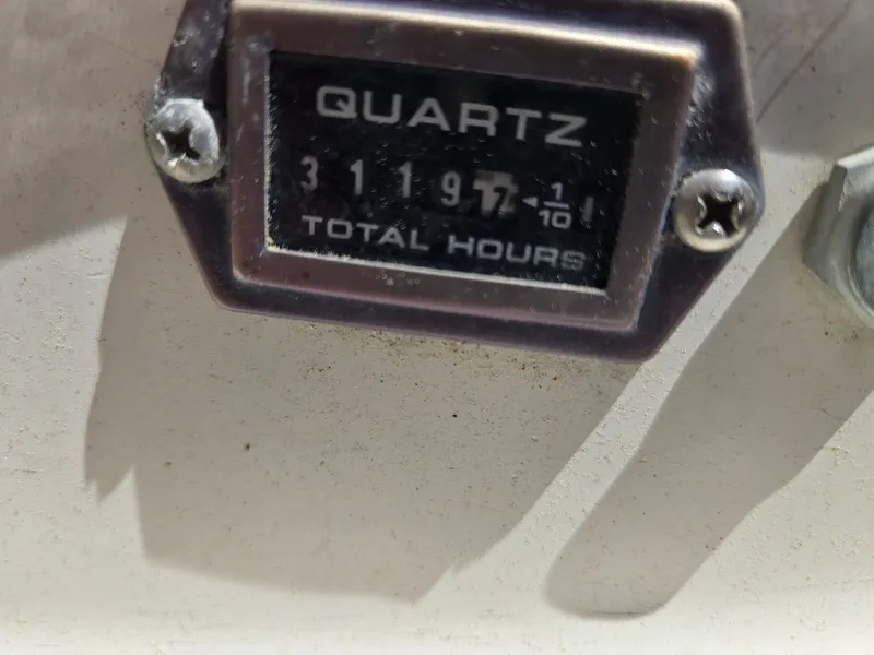 Slide: The Image of Hour meter on 1995 Freedom sloop, displaying 3119.7 hours. - 29
