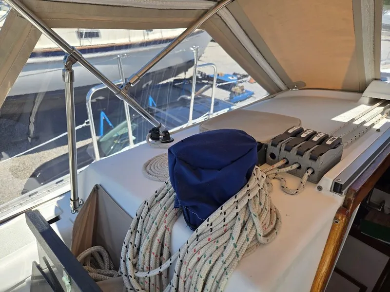 Slide: The Image of Interior view of a 1995 Freedom sloop with ropes and cover. - 32