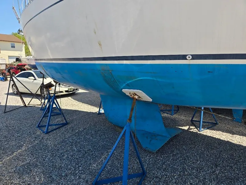 Slide: The Image of 1995 Freedom Sloop on stands outdoors. - 38