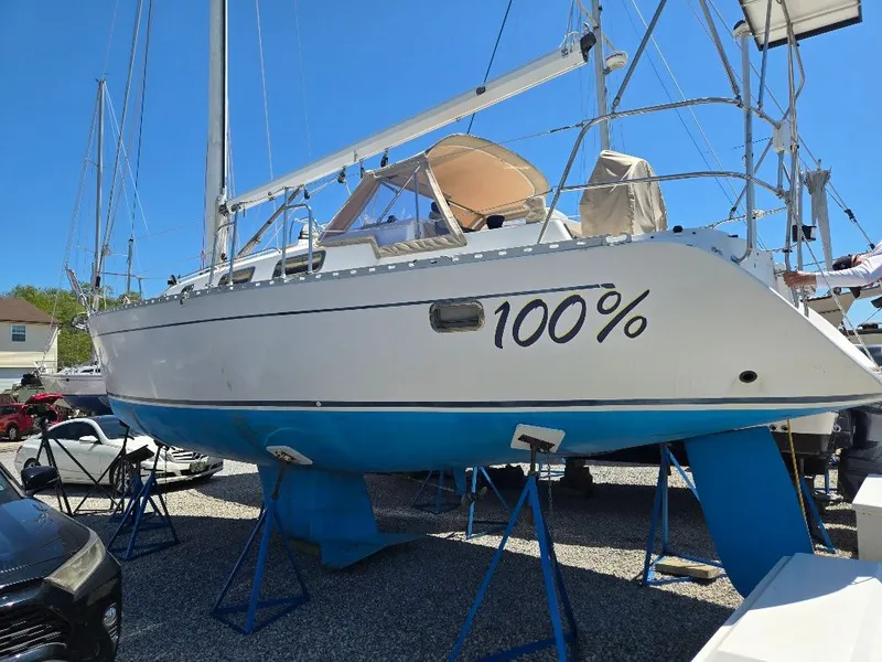 Slide: The Image of 1995 Freedom Sloop on stands outdoors. - 39