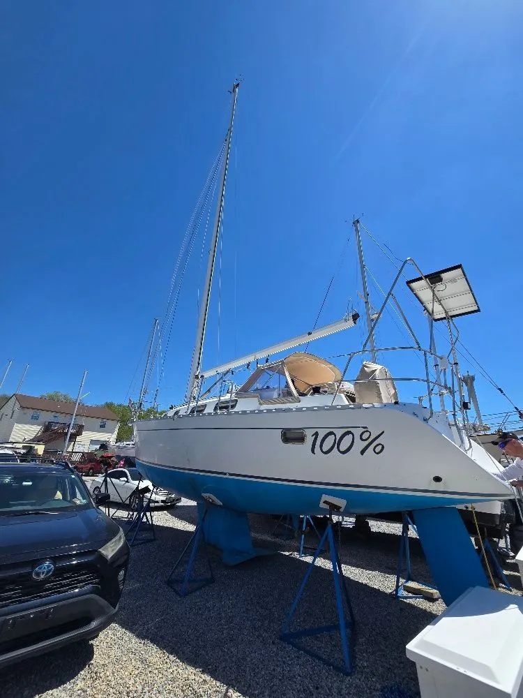 Slide: The Image of 1995 Freedom Sloop sailboat on stands outdoors. - 40
