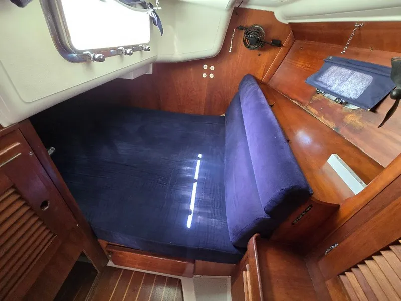 Slide: The Image of Interior of a 1995 Freedom sloop with blue upholstery. - 6