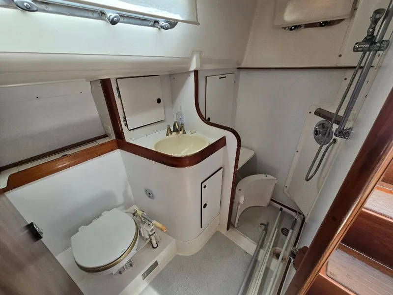 Slide: The Image of Interior view of a 1995 Freedom Sloop yacht bathroom. - 9