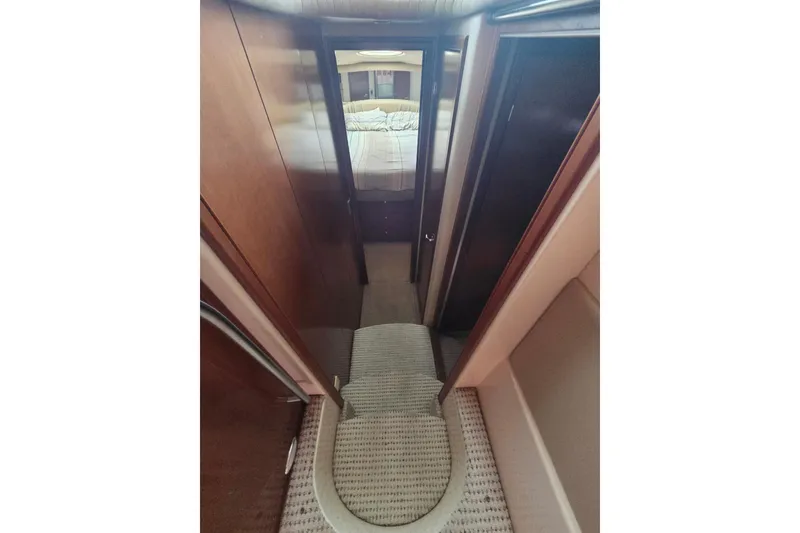 Slide: The Image of Interior hallway of 2006 Meridian 411 Sedan yacht, leading to a cozy bedroom. - 15