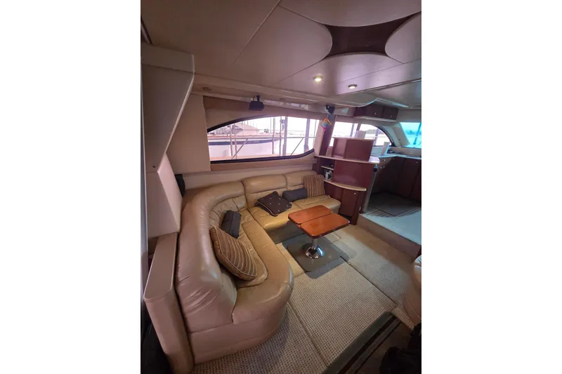 Slide: The Image of Luxurious interior of a 2006 Meridian 411 Sedan yacht with plush seating and elegant decor. - 20