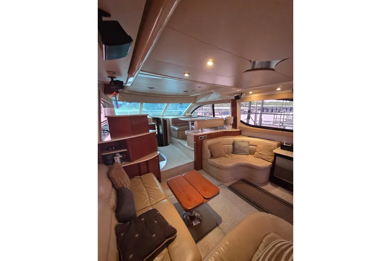 Slide: The Image of Luxurious interior of a 2006 Meridian 411 Sedan yacht with plush seating and elegant design. - 21