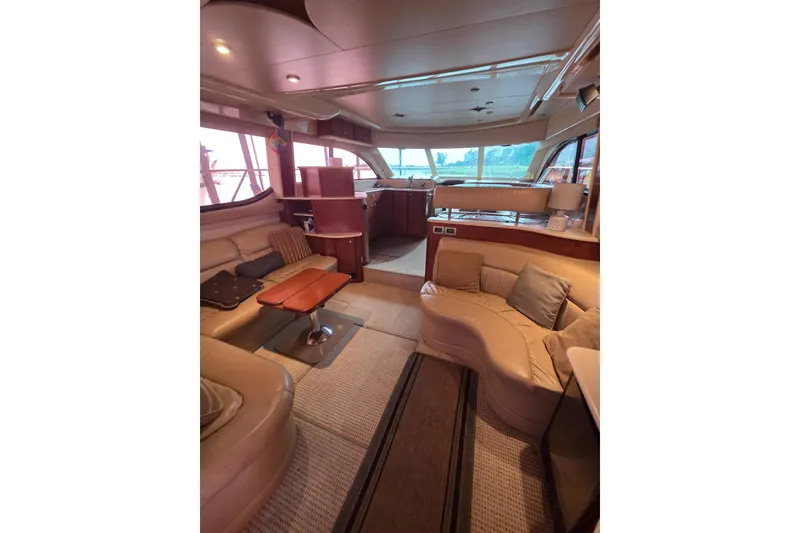 Slide: The Image of Luxurious interior of a 2006 Meridian 411 Sedan yacht with plush seating and elegant design. - 22