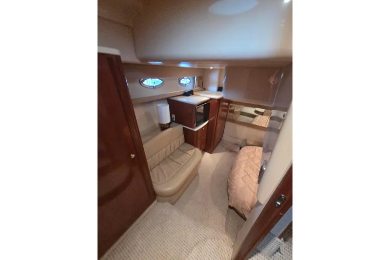 Slide: The Image of Interior of 2006 Meridian 411 Sedan yacht with cozy seating and elegant wood finishes. - 23