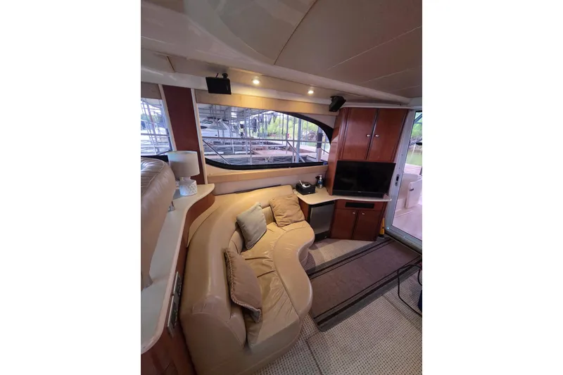 Slide: The Image of Interior of 2006 Meridian 411 Sedan yacht with cozy seating and modern amenities. - 9