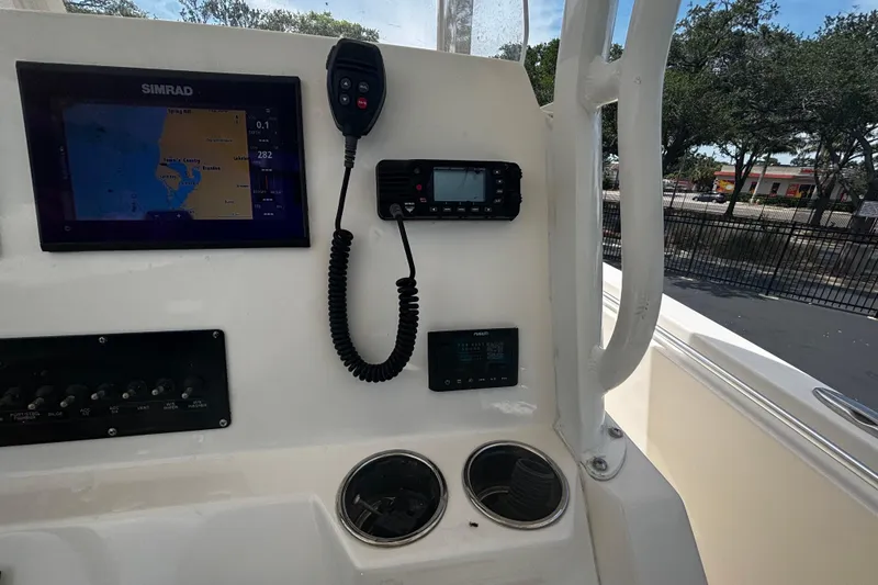 Slide: The Image of 2023 Cobia 262 Center Console dashboard with navigation and communication equipment. - 5