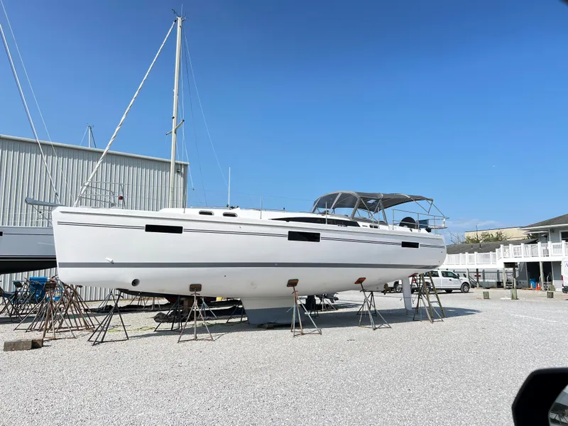The Image of 2026 Catalina 426 sailboat on stands in a boatyard under clear blue sky. - 0