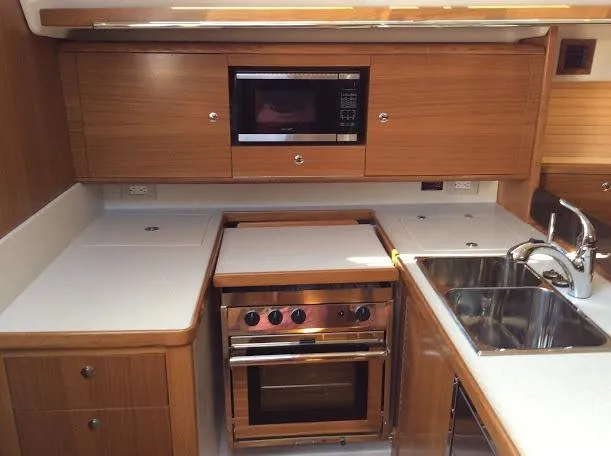Slide: The Image of Modern kitchen in 2026 Catalina 426 yacht with wood cabinetry and stainless steel appliances. - 10