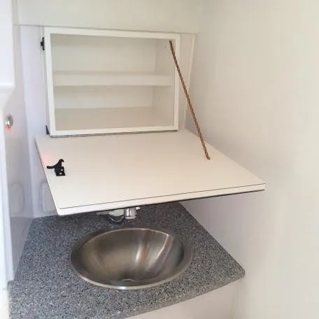 Slide: The Image of Compact sink area with foldable shelf in Catalina 426, 2026 model. - 22
