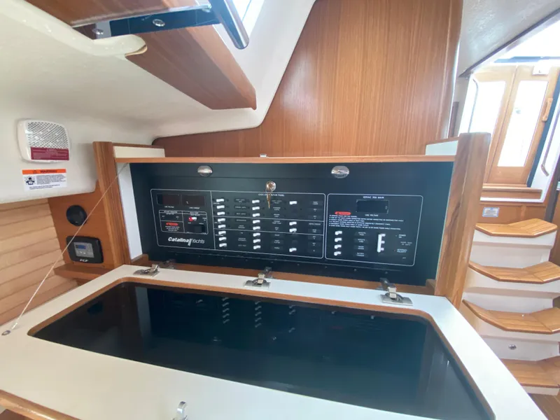 Slide: The Image of Interior of 2026 Catalina 426 yacht with control panel and wooden stairs. - 26