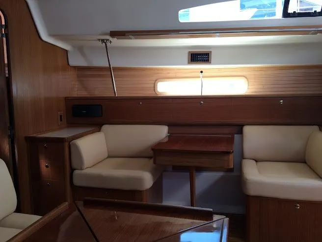 Slide: The Image of Interior of 2026 Catalina 426 sailboat with wooden furnishings and beige seating. - 32