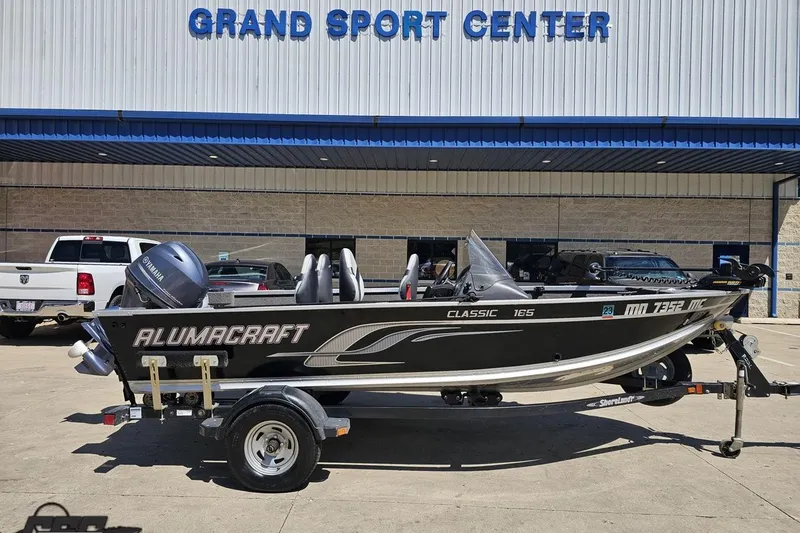 The Image of 2014 Alumacraft Classic 165 boat on trailer at Grand Sport Center. - 1