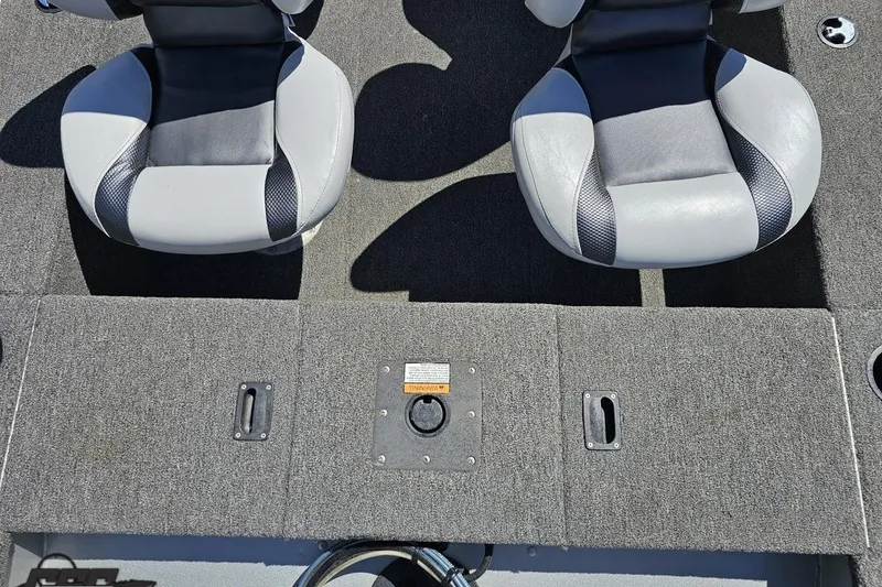 Slide: The Image of 2014 Alumacraft Classic 165 boat interior with two gray seats and carpeted flooring. - 30