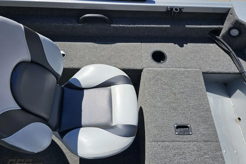 Slide: The Image of 2014 Alumacraft Classic 165 boat interior with gray seating and carpeted flooring. - 32
