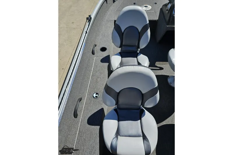 Slide: The Image of 2014 Alumacraft Classic 165 boat interior with two gray and black seats. - 35