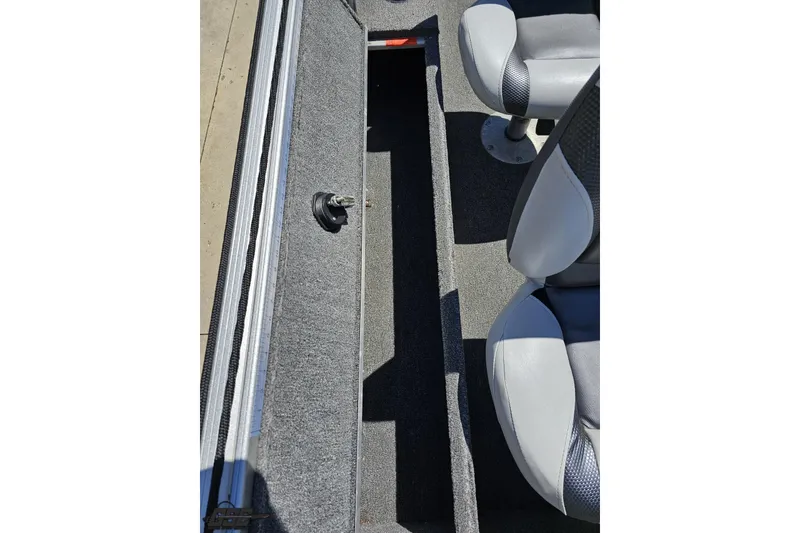 Slide: The Image of 2014 Alumacraft Classic 165 boat interior with seating and storage compartment. - 36