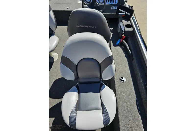Slide: The Image of 2014 Alumacraft Classic 165 boat interior with gray seating and dashboard view. - 37