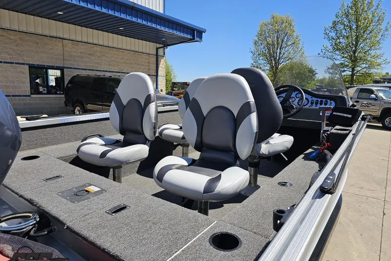 Slide: The Image of 2014 Alumacraft Classic 165 boat interior with gray seats and steering console. - 7
