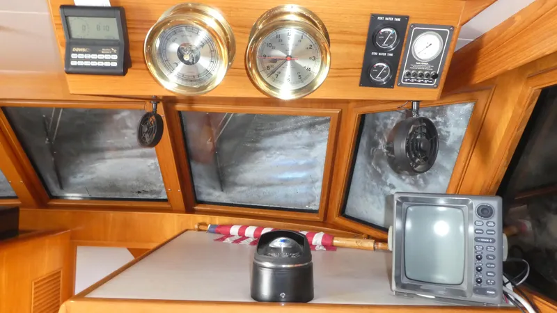 Slide: The Image of Interior helm of 1992 Ocean Alexander 456 Classicco with navigation instruments and gauges. - 16