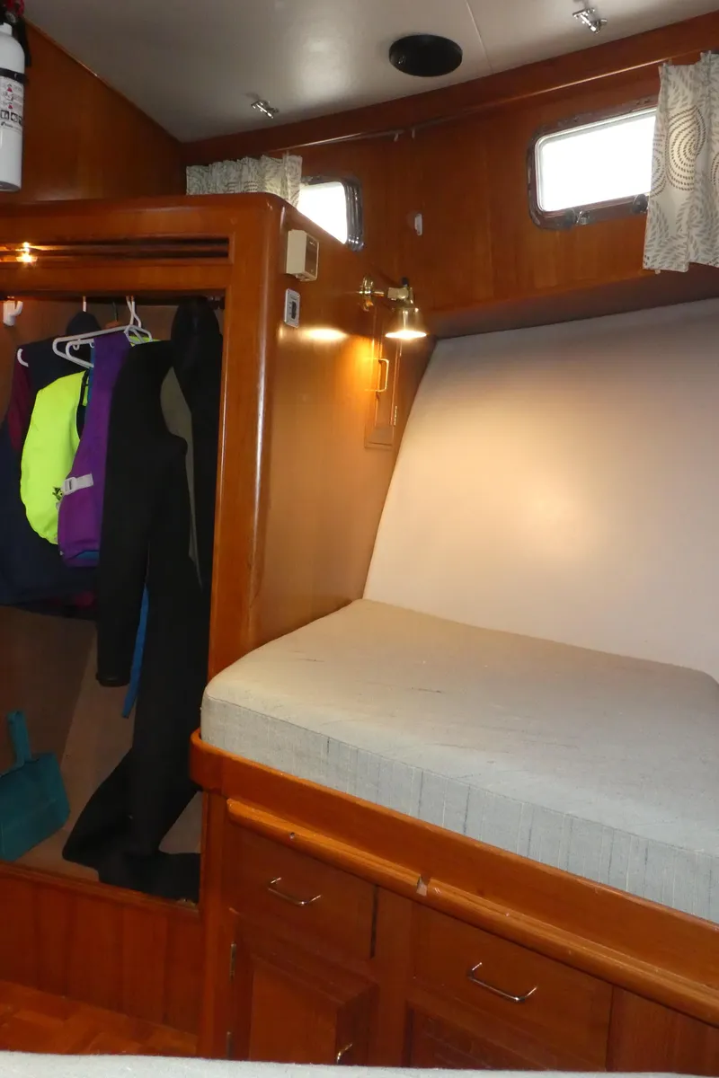 Slide: The Image of Cozy cabin interior of 1992 Ocean Alexander 456 Classicco yacht with wooden finishes. - 22