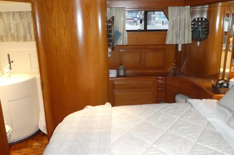 Slide: The Image of Luxurious 1992 Ocean Alexander 456 Classicco yacht bedroom with elegant wood finish. - 31