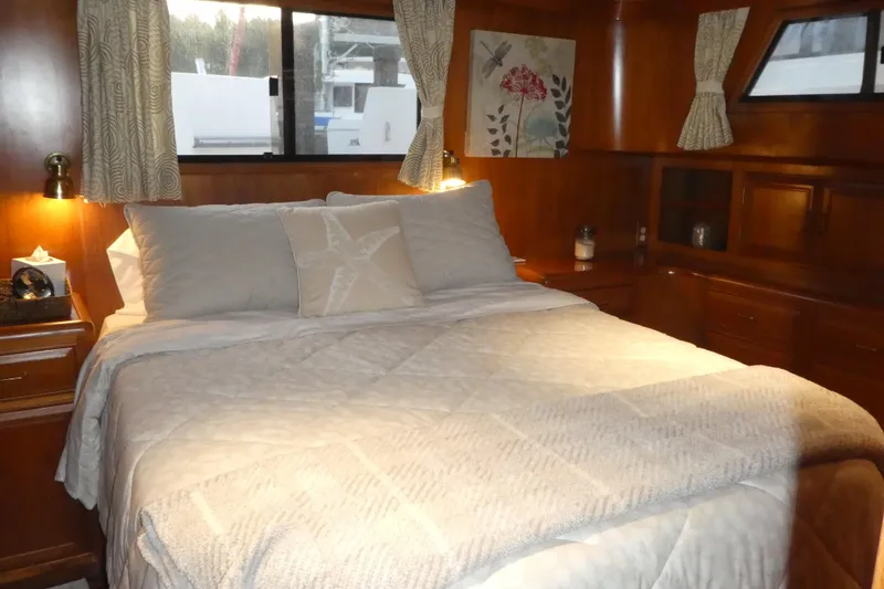 Slide: The Image of Cozy bedroom interior of 1992 Ocean Alexander 456 Classicco yacht with elegant wood finish. - 36