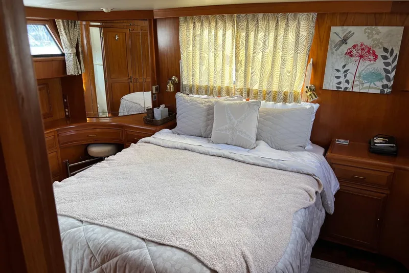 Slide: The Image of Luxurious bedroom interior of 1992 Ocean Alexander 456 Classicco yacht with elegant wood finish. - 37