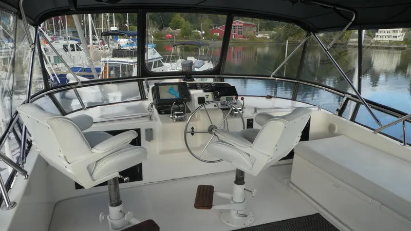 Slide: The Image of Interior view of 1992 Ocean Alexander 456 Classicco yacht cockpit with steering wheel and navigation equipment. - 41