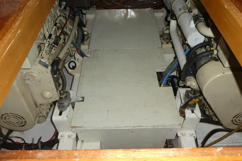 Slide: The Image of Engine room of 1992 Ocean Alexander 456 Classicco yacht, showcasing dual engines and mechanical components. - 46