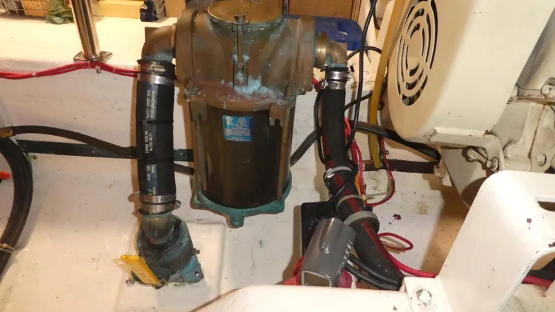 Slide: The Image of Engine room of 1992 Ocean Alexander 456 Classicco with visible pump and wiring. - 52