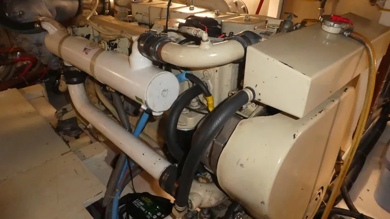 Slide: The Image of Engine room of 1992 Ocean Alexander 456 Classicco yacht, showcasing mechanical components. - 53